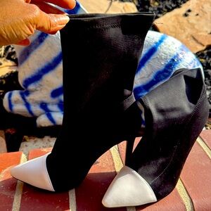 Cute black and white heeled boot with leather toe fitted very cute boot